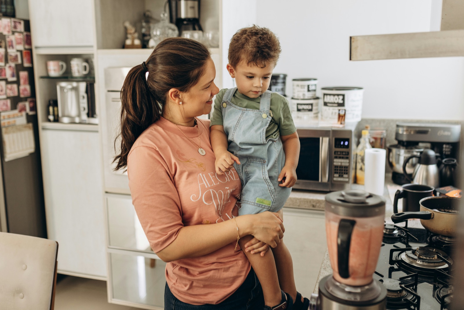 A technician inspecting an appliance during a home service visit